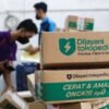 Employees pack goods at Goto's e-commerce unit Tokopedia's warehouse in Jakarta, Indonesia, August 31, 2022. REUTERS/Ajeng Dinar Ulfiana