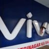 A man cleans the logo of a Chinese smartphone brand Vivo outside a store in Ahmedabad, India, October 10, 2023 REUTERS/Amit Dave/File photo