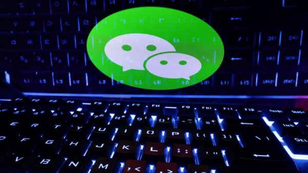 A keyboard is placed in front of a displayed WeChat logo in this illustration taken February 21, 2023. REUTERS/Dado Ruvic/Illustration A keyboard is placed in front of a displayed WeChat logo in this illustration taken February 21, 2023. REUTERS/Dado Ruvic/Illustration