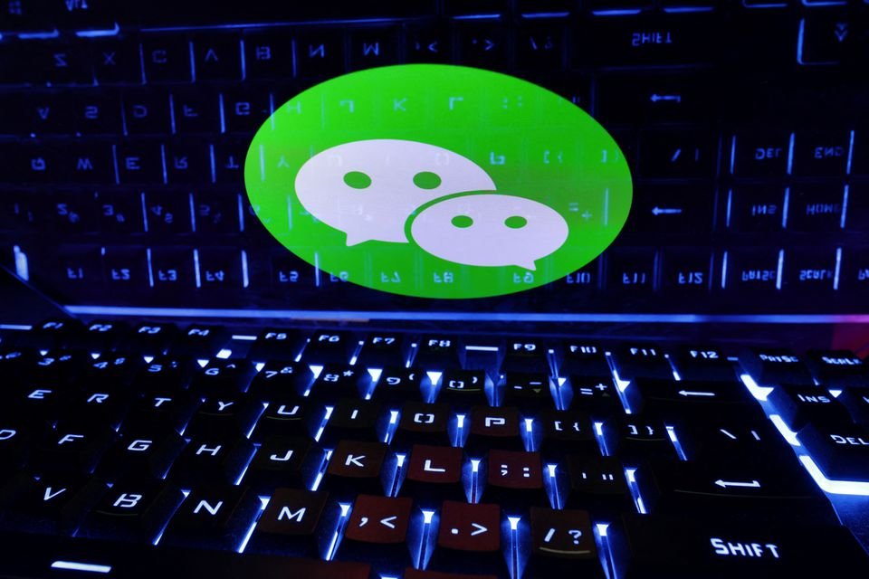 A keyboard is placed in front of a displayed WeChat logo in this illustration taken February 21, 2023. REUTERS/Dado Ruvic/Illustration A keyboard is placed in front of a displayed WeChat logo in this illustration taken February 21, 2023. REUTERS/Dado Ruvic/Illustration