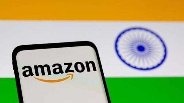 Smartphone with Amazon logo is seen in front of displayed Indian flag in this illustration taken, July 30, 2021. REUTERS/Dado Ruvic/Illustration/File Photo