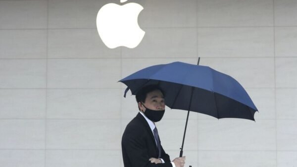 Man walks past an Apple store in Taipei, Taiwan October 20, 2020. Picture taken October 20, 2020. REUTERS/Ann Wang