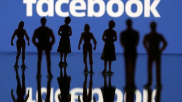 Small toy figures are seen in front of Facebook logo in this illustration picture, April 8, 2019. REUTERS/Dado Ruvic/Illustration