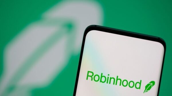 Robinhood logo is seen on a smartphone in front of a displayed same logo in this illustration taken, July 2, 2021. REUTERS/Dado Ruvic/Illustration