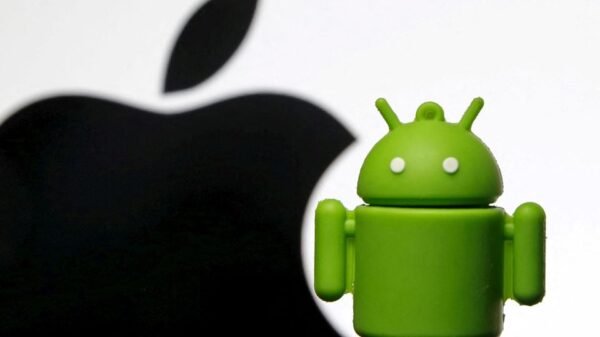 An Android mascot is seen in front of a displayed logo of Apple in this photo illustration taken in Zenica, Bosnia and Herzegovina, May 5, 2015. Picture taken on May 5. REUTERS/Dado Ruvic/File Photo