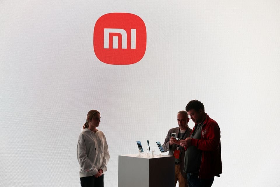 People check new products of Xiaomi ahead of the 2023 Mobile World Congress in Barcelona, Spain February 26, 2023. REUTERS/Nacho Doce/File Photo