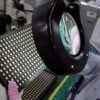 worker inspects semiconductor chips at the chip packaging firm Unisem (M) Berhad plant in Ipoh, Malaysia October 15, 2021. REUTERS/Lim Huey Teng/File Photo